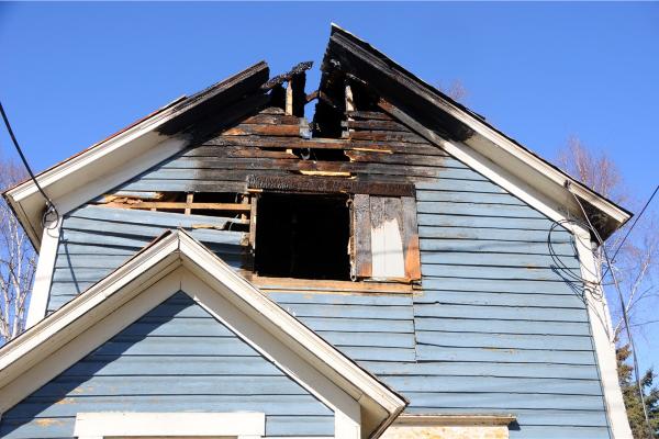Fire-damaged house roof
